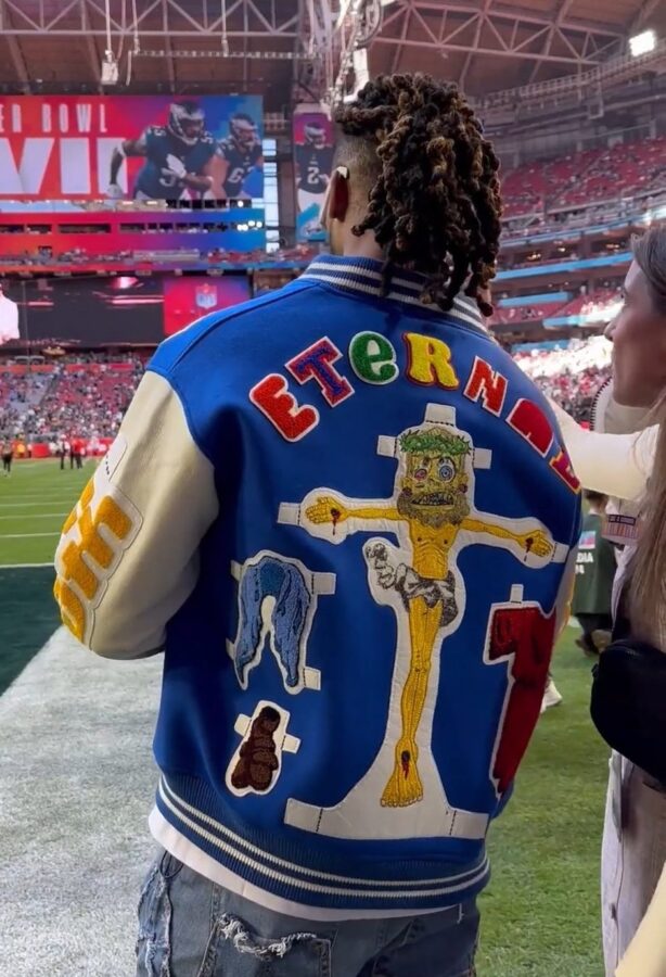 HERE WE GO, and THE DEVIL IS A LIE: We would like to know what WOKE HOMOSEXUAL individual or group paid Damar Hamlin or gave to his foundation 30 pieces of silver to betray God and Christ who saved his life by wearing this gross, blasphemous, effeminate, WOKE jacket depicting Jesus Christ in the worse way in 2000 years.